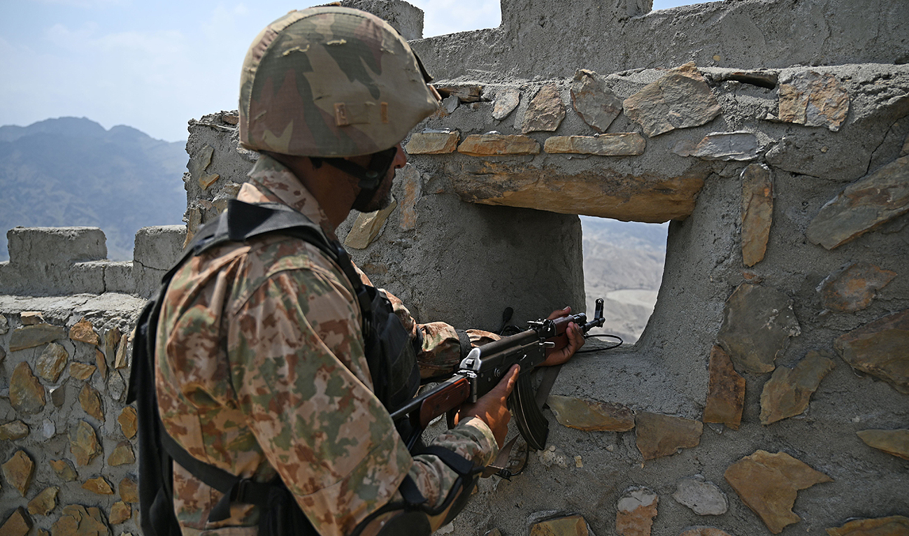 In this file photo, taken on August 3, 2021, a Pakistani army soldier mans a position near Big Ben post in Khyber district in Khyber Pakhtunkhwa province. (AFP/File)