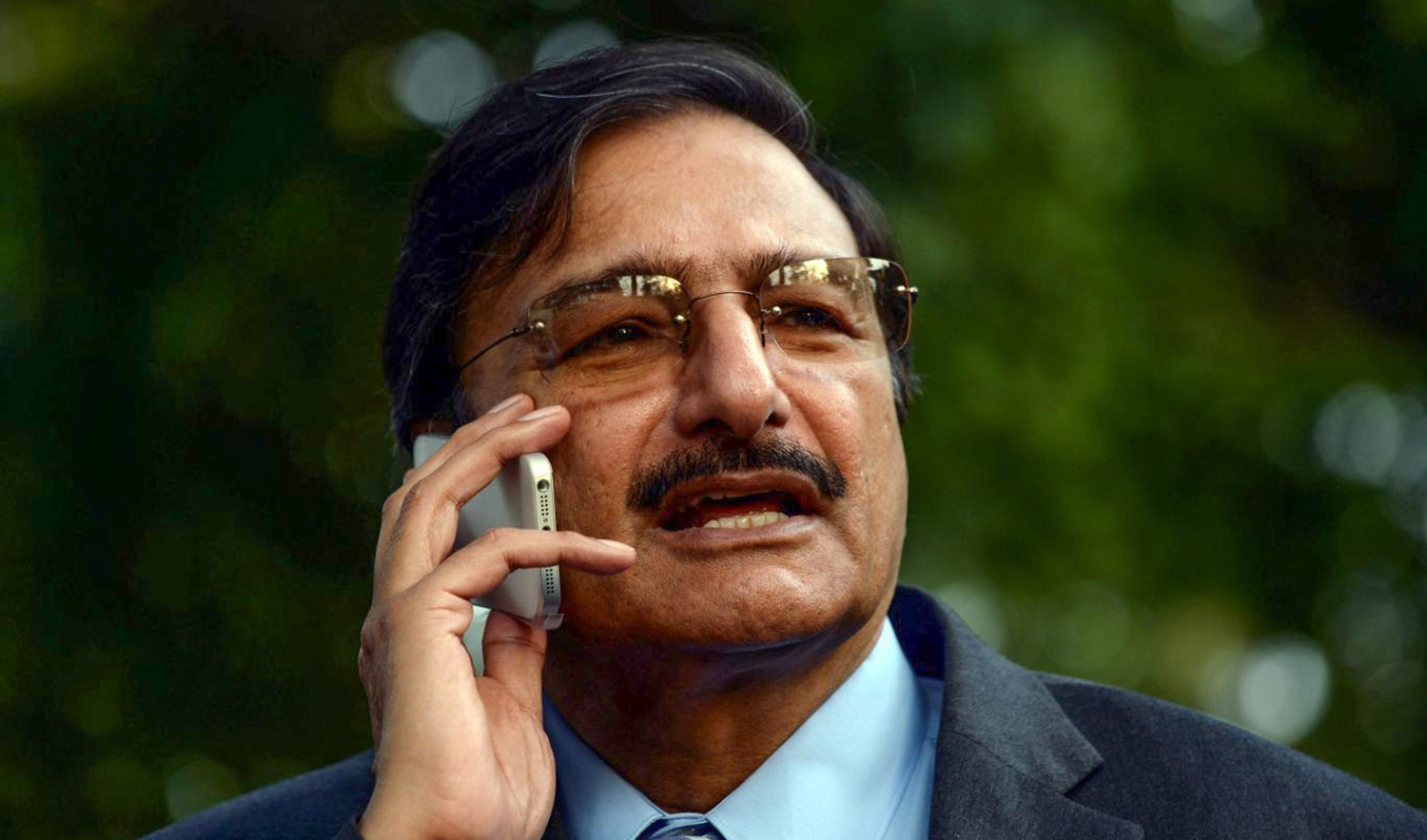 Pakistan Cricket Board (PCB) chairman Zaka Ashraf speaks on a cell phone in Lahore on February 10, 2014. (AFP/File)