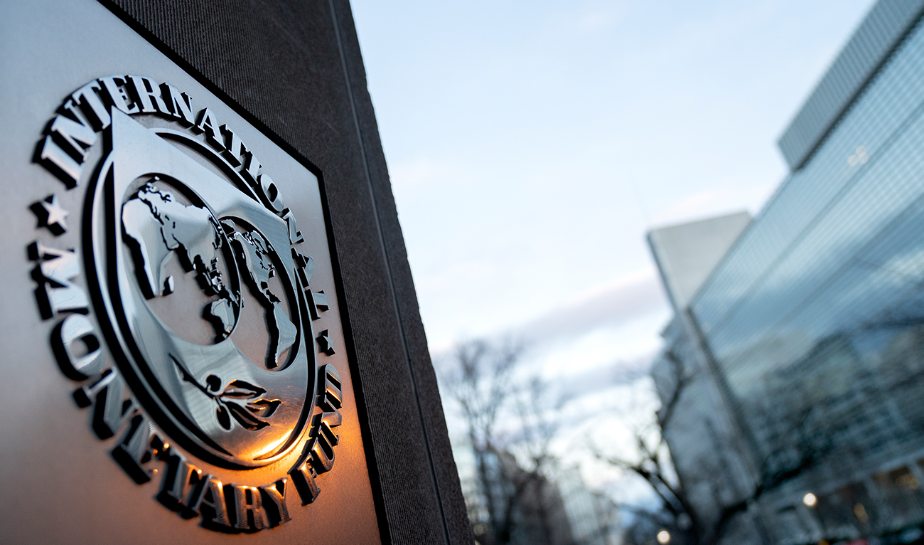 The seal for the International Monetary Fund is seen near the World Bank headquarters (R) in Washington, DC on January 10, 2022. (AFP/File)