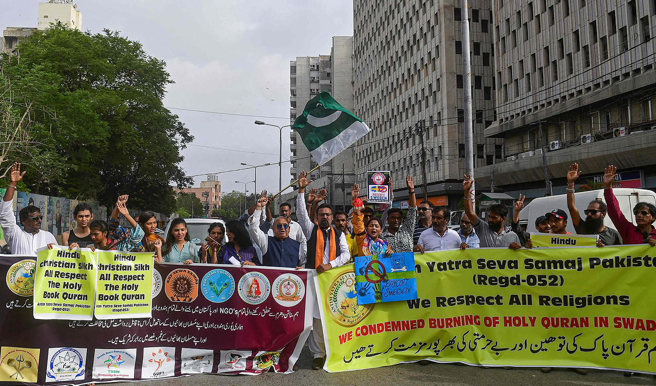 Members of Hindu community shout slogans during a demonstration in Karachi on July 14, 2023, as they protest against the burning of the Holy Qur'an outside a Stockholm mosque that outraged Muslims around the world. (AFP)
