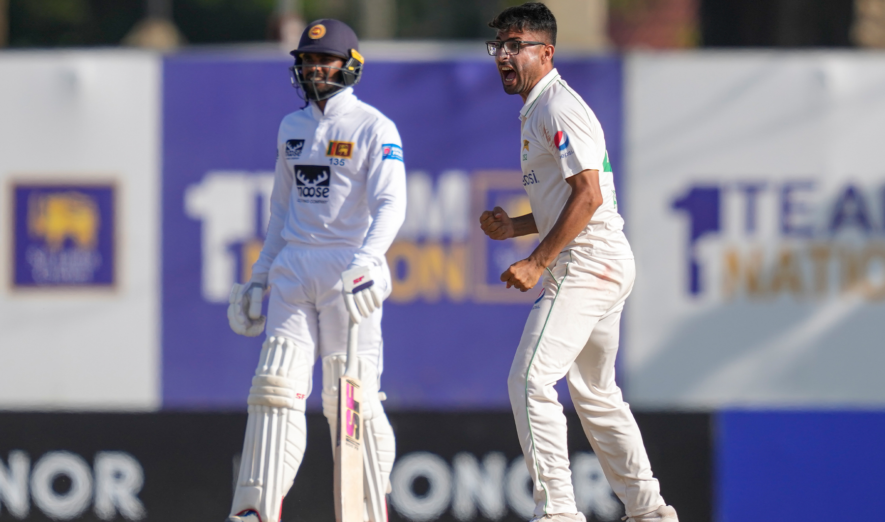 Pakistan's Abrar Ahmed, right, celebrates the wicket of Sri Lanka's Ramesh Mendis as Dhananjaya de Silva watches during the fourth day of the first cricket test match between Sri Lanka and Pakistan in Galle, Sri Lanka, on July 19, 2023. (AP)