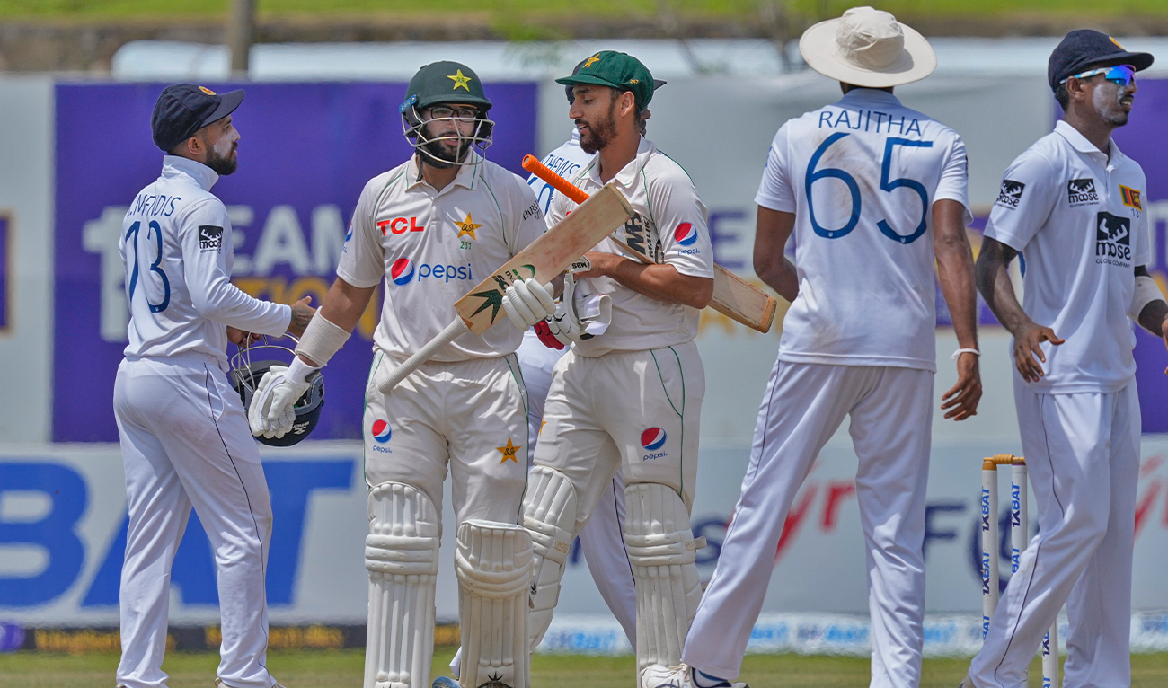 Sri Lankan team members congratulate Pakistan's Imam-ul-Haq and Agha Salman for their teams' win over Sri Lanka by four wickets in the first cricket test match between Sri Lanka and Pakistan in Galle, Sri Lanka, on July 20, 2023. (AP)