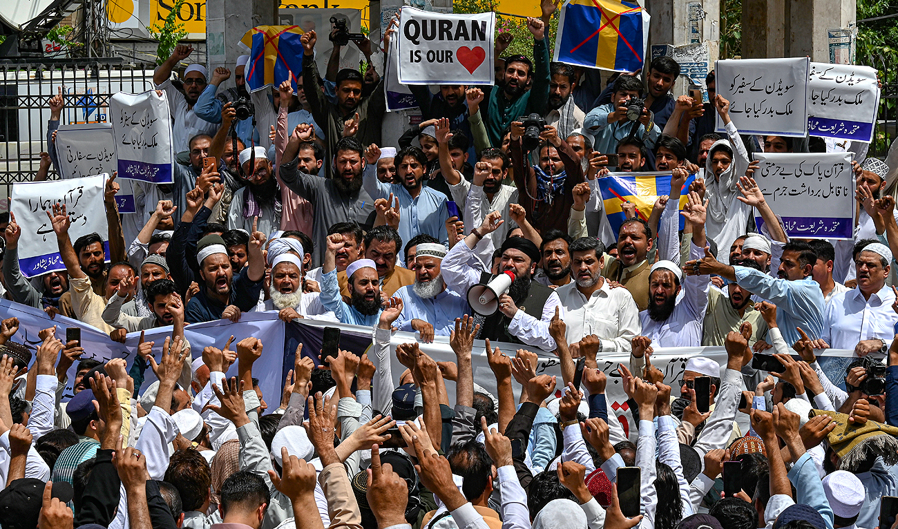 People take part in a demonstration in Peshawar on July 7, 2023, as they protest against the burning of the Qur'an outside a Stockholm mosque that outraged Muslims around the world. (AFP)