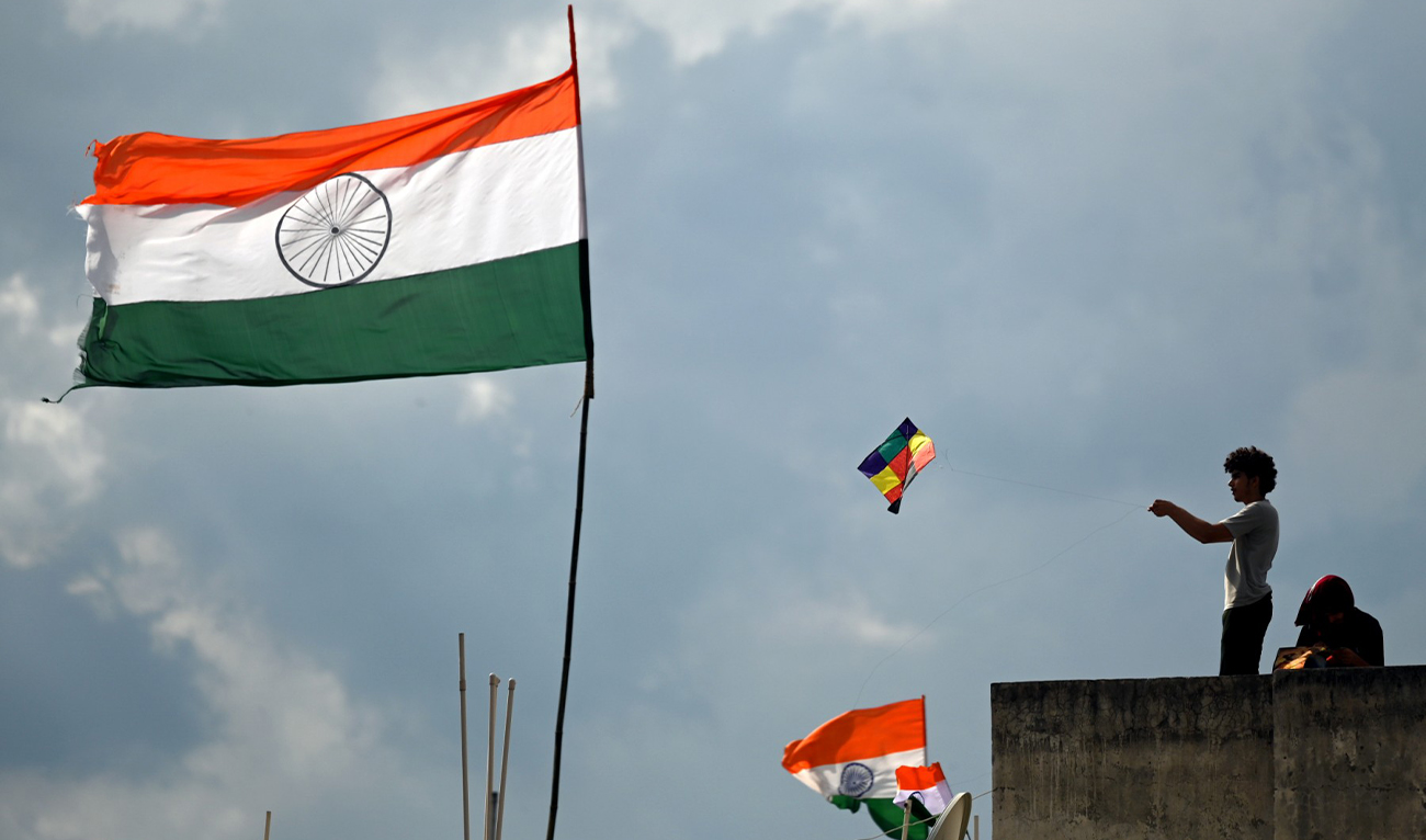 A man flies a kite from the roof of his house during the celebrations to mark India's 75th Independence Day in New Delhi on August 15, 2022. (AFP/File)