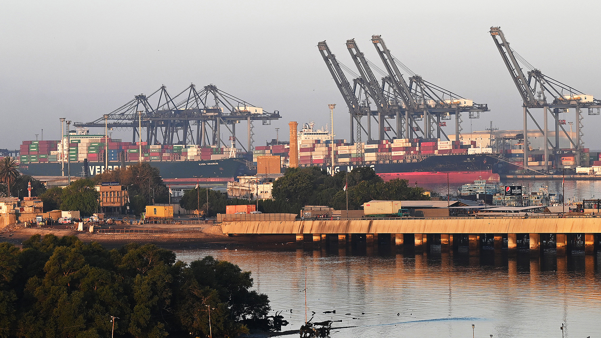 Shipping containers are seen stacked on a ship at a sea port in Karachi on April 6, 2023. (AFP/File)