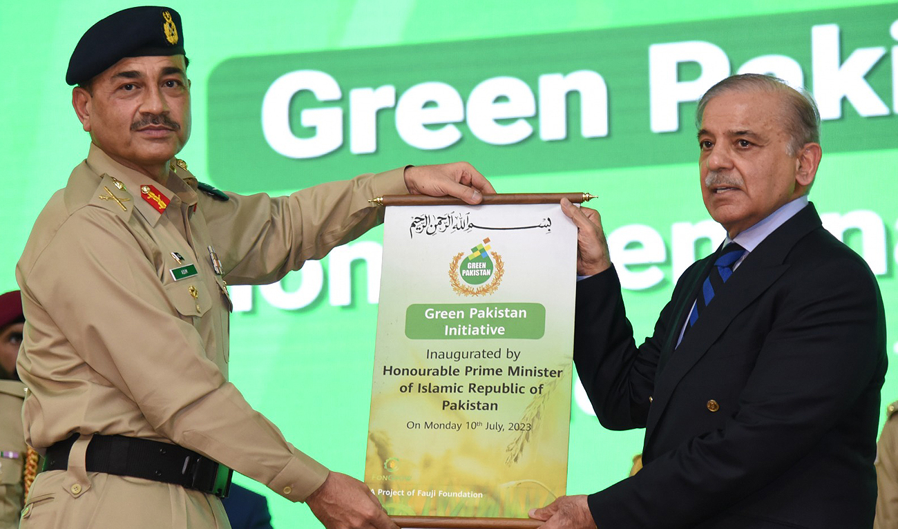 Pakistan Army Chief General Syed Asim Munir hands over the inaugural scroll of the Green Pakistan Initiative program to Prime Minister Shehbaz Sharif in Islamabad on July 10, 2023. (Photo courtesy: Prime Minister's Office)