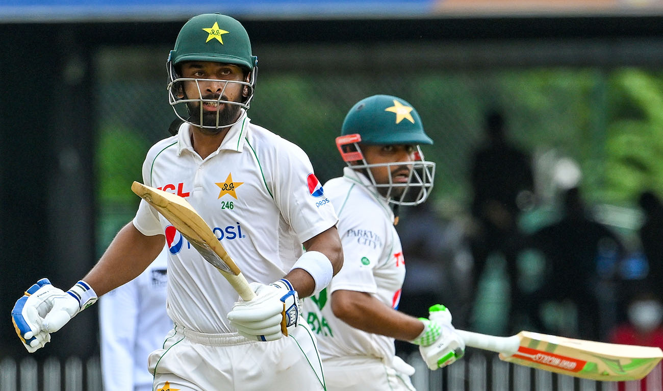 Pakistan's Abdullah Shafique (L) and Babar Azam run between the wickets during the second day of the second and final cricket Test match between Pakistan and Sri Lanka at the Sinhalese Sports Club (SSC) Ground in Colombo on July 25, 2023. (AFP/File)