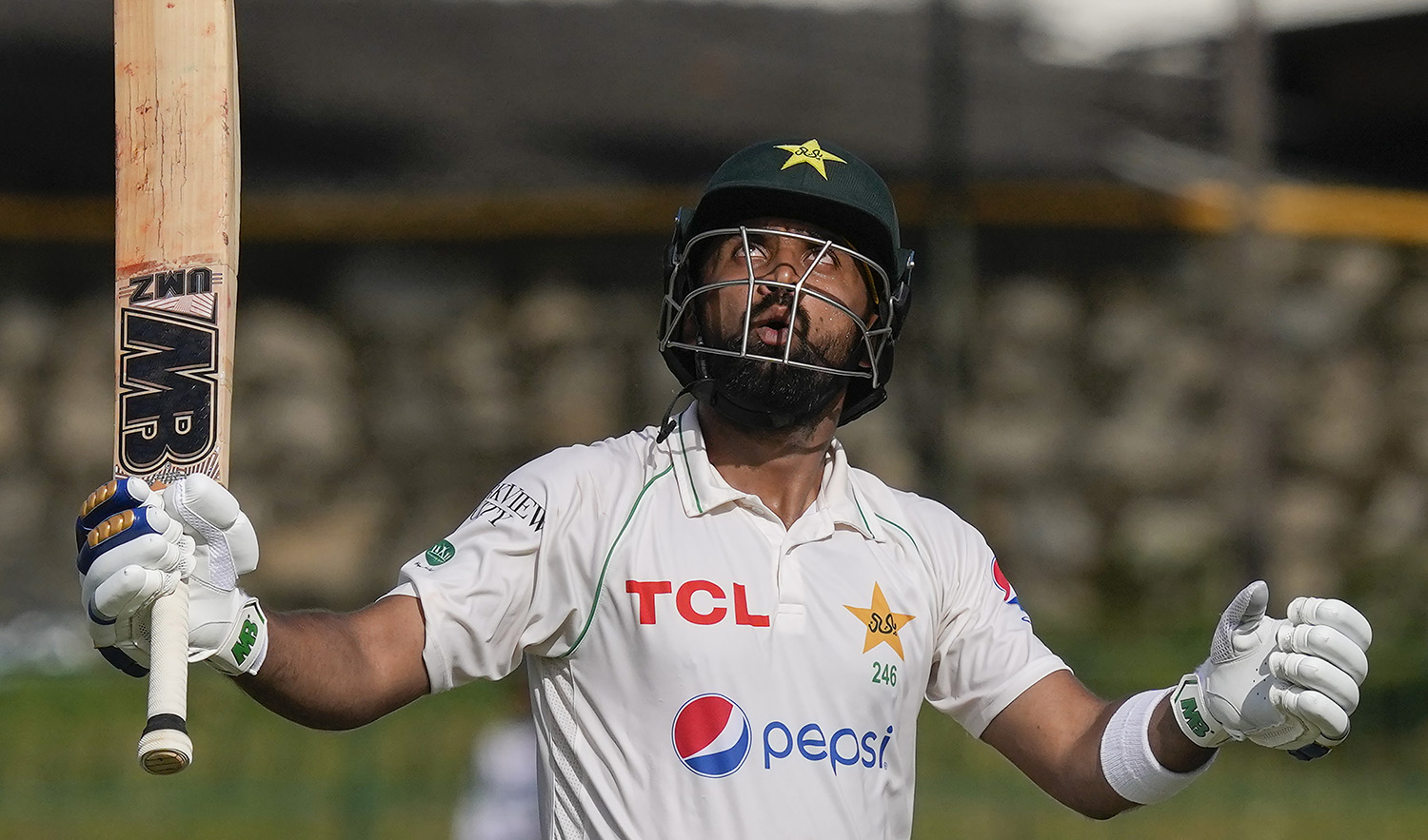 Pakistan's Abdullah Shafique looks skywards as he celebrates scoring a double century during the third day of the second cricket test match against Sri Lanka in Colombo, Sri Lanka on July 26, 2023. (AP)