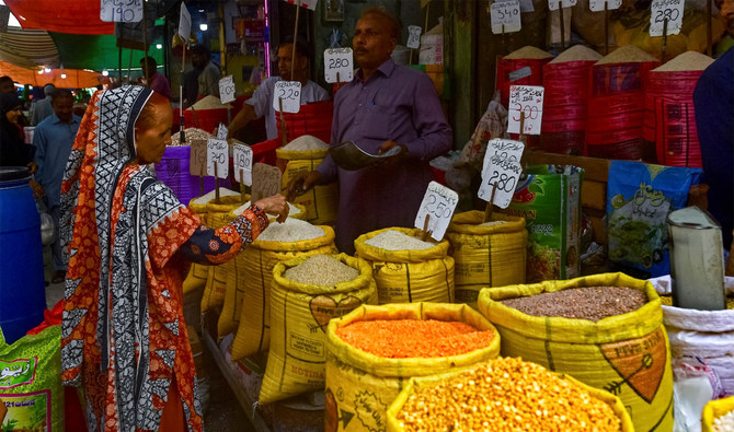 A customer buys rice at a wholesale shop in Karachi, Pakistan, on June 8, 2023. (AFP/File)