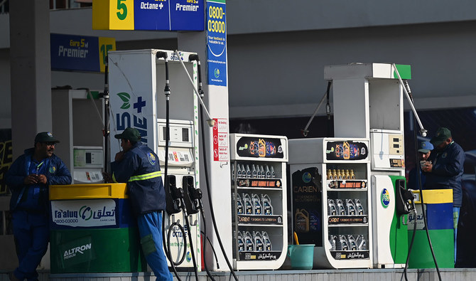 Employees at a fuel station wait for customers in Islamabad on February 16, 2022. (AFP/File)