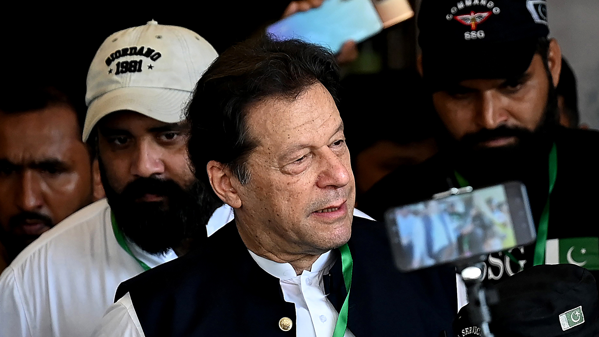 In this photo, taken on July 26, 2023, Pakistan's former prime minister Imran Khan (C) leaves after appearing in the Supreme Court in Islamabad. (AFP)