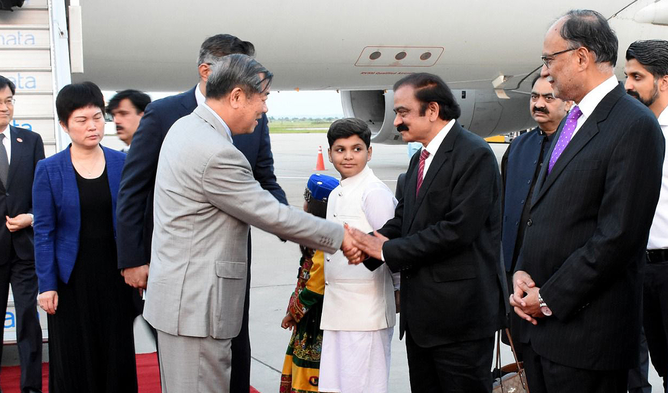 In this handout photo taken and released by the Ministry of Interior, Pakistan, Chinese Vice Premier He Lifeng shakes hands with Pakistan Interior Minister Rana Sanaullah as he arrived in Islamabad on July to mark the 10th anniversary of the China-PakistanEconomic Corridor project. (Photo courtesy: Ministry of Interior)