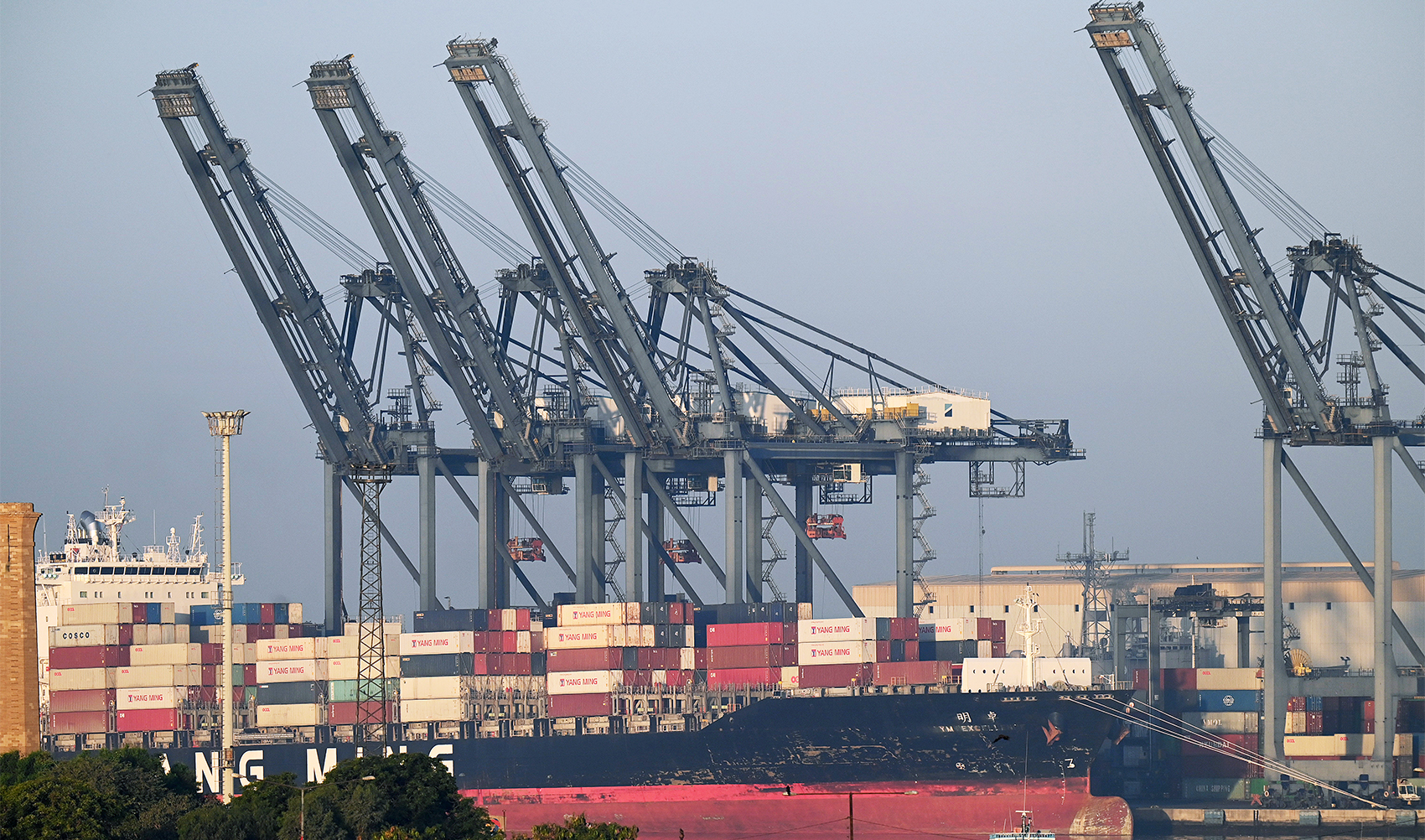 Shipping containers are seen stacked on a ship at a sea port in Karachi on April 6, 2023. (AFP/File)