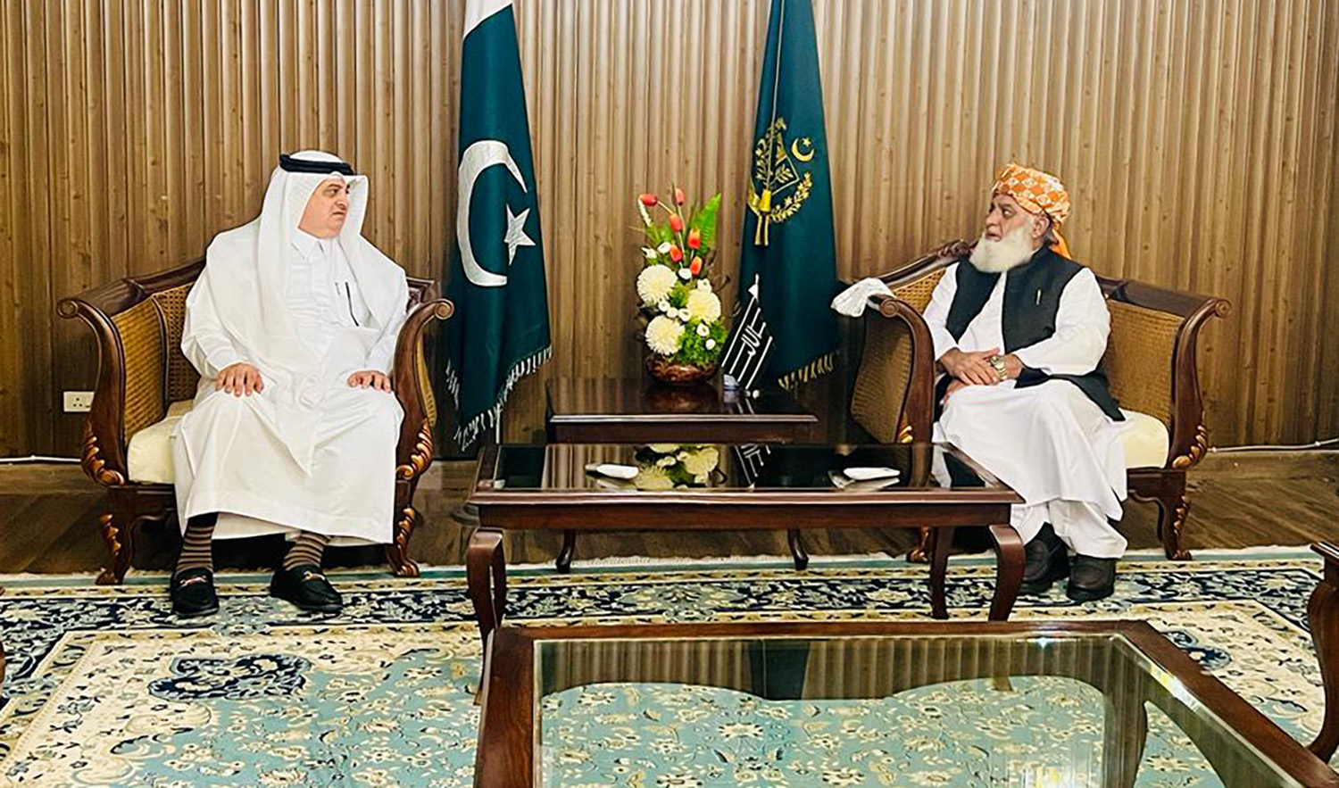 Saudi Ambassador Nawaf bin Said Al-Malki, left, meets Pakistani politician Maulana Fazlur Rehman in Islamabad on July 31, 2023, to condole over a suicide bombing at his political party in Bajaur district. (Photo courtesy: @KSAembassyPK/Twitter)