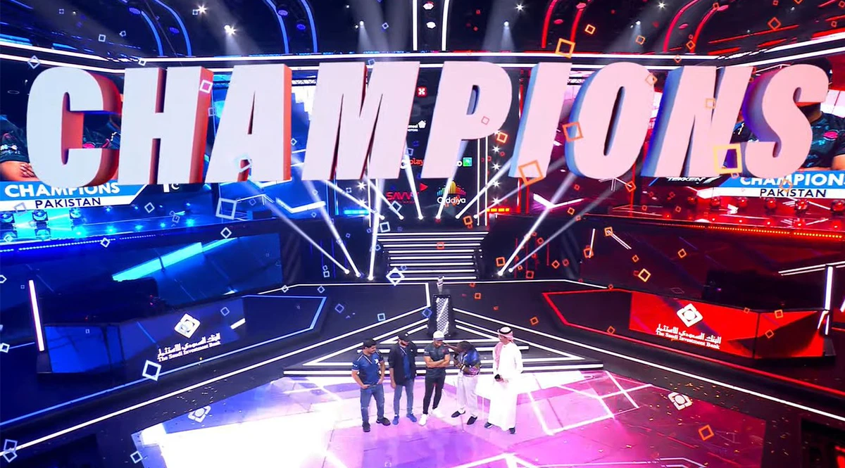 Pakistan's Arslan Siddique aka “Arslan Ash,” Imran Khan and Atif Butt lift trophy as they win TEKKEN 7 Nations Cup in Riyadh, Saudi Arabia, on July 9, 2023. (@Muneeb313_/Twitter)