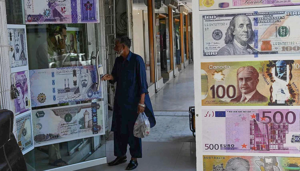 A man enters a foreign currency exchange shop in Islamabad, Pakistan on July 11, 2023. (AFP)