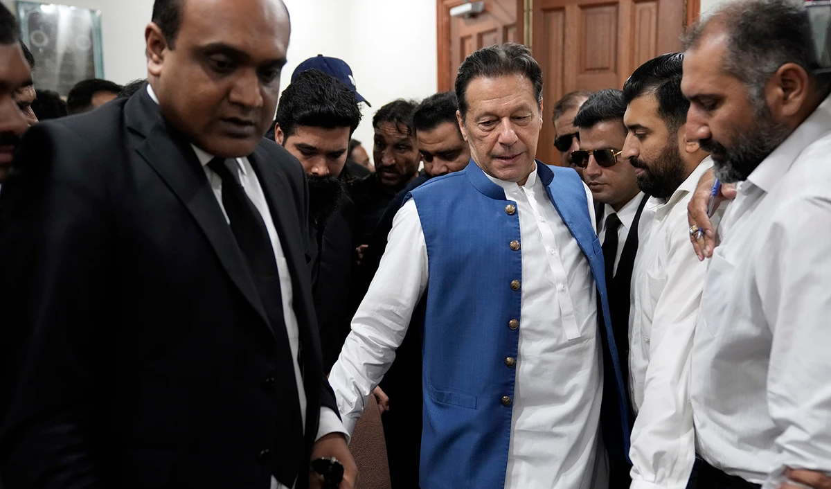 Pakistan's former Prime Minister Imran Khan arrives to sign documents as he submits surety bond over his bails in different cases at an office of Lahore High Court in Lahore, Pakistan, on July 18, 2023. (AP)