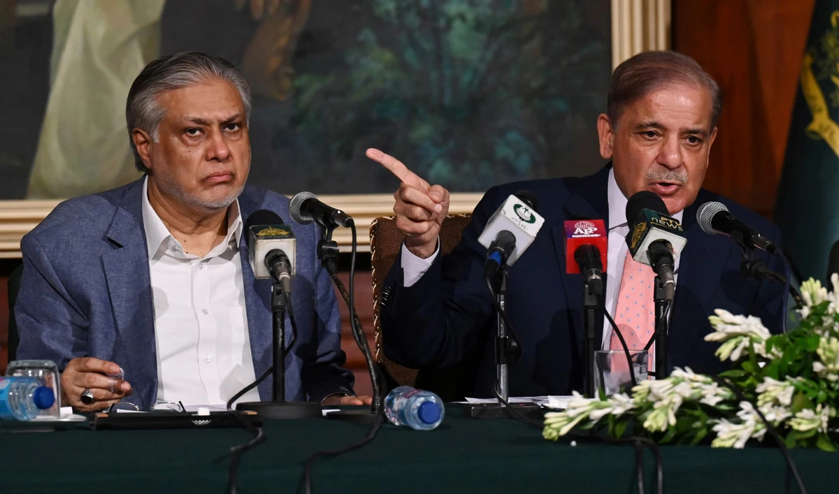 Pakistan's Prime Minister Shehbaz Sharif (R) and Pakistan's Finance Minister Ishaq Dar (L) address a press conference in Lahore, Pakistan, on June 30, 2023. (AFP/File)