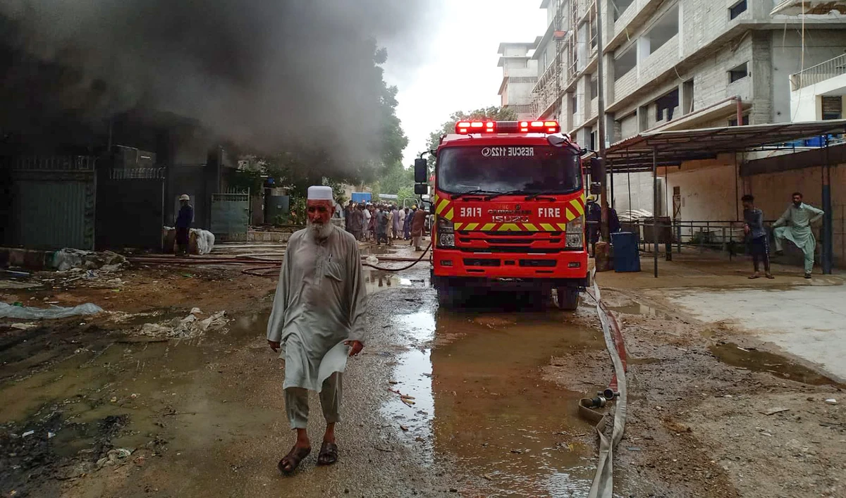 A fire tender can be seen at the site of a factory fire in Pakistan's port city of Karachi on July 28, 2023. (Photo courtesy: @murtazawahab1/Twitter)
