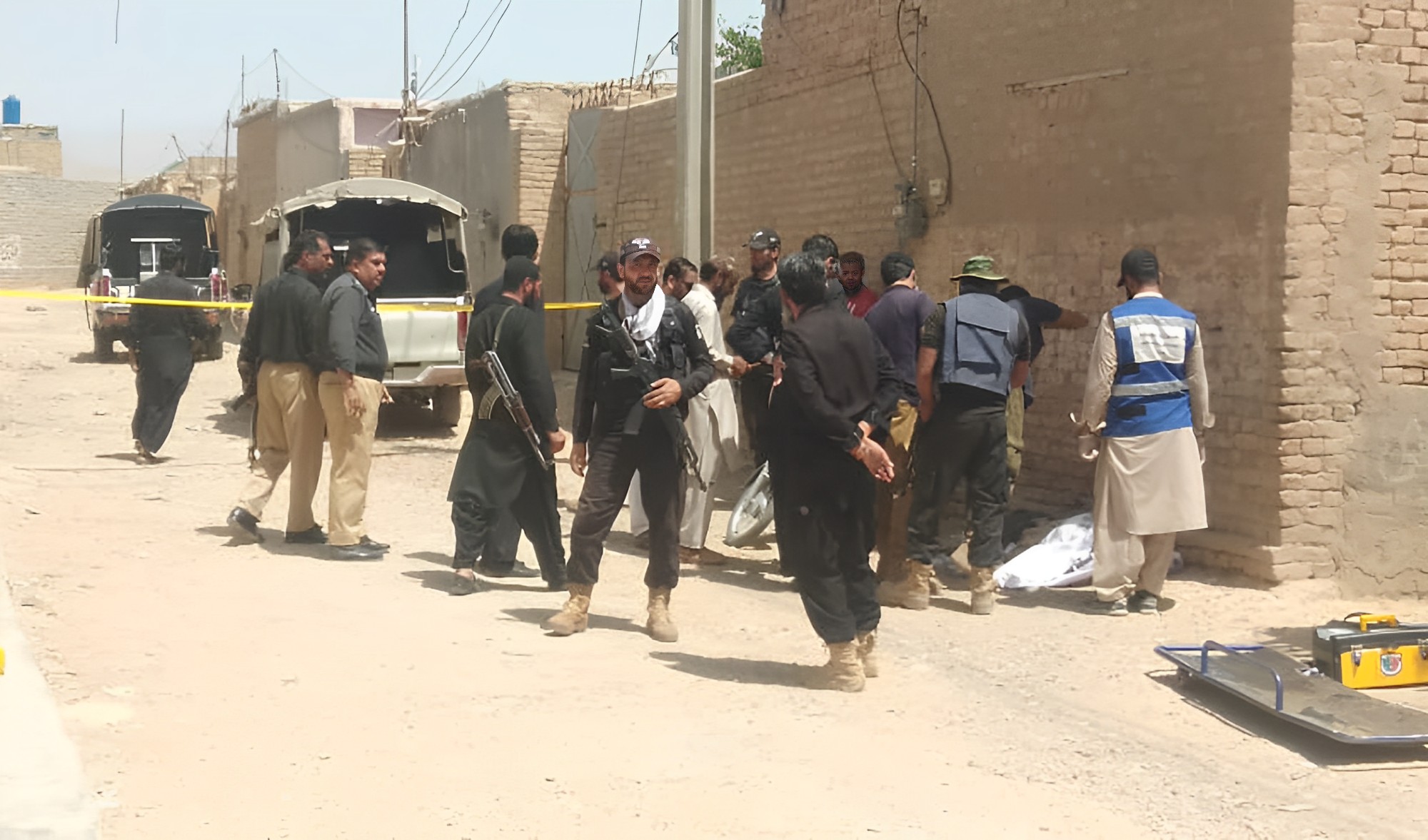 Police officers and rescue officials stand at the site of an attack on police officers in Quetta, Pakistan on August 1, 2023. (AN photo)