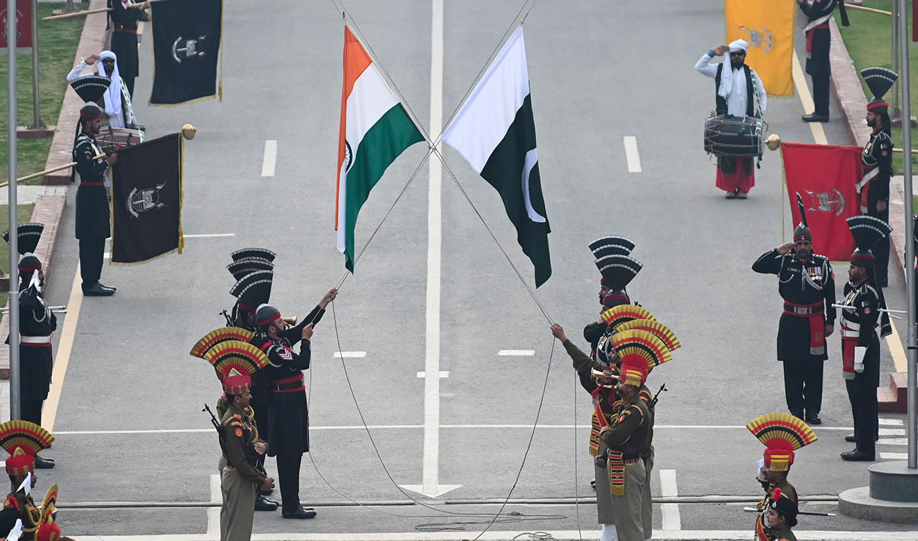 Indian Border Security Force (BSF) soldiers and Pakistani Rangers (in black) take part in the daily beating Retreat ceremony at the India Pakistan Wagah border post, some 35 Km from Amritsar on February 17, 2023. (AFP/File)