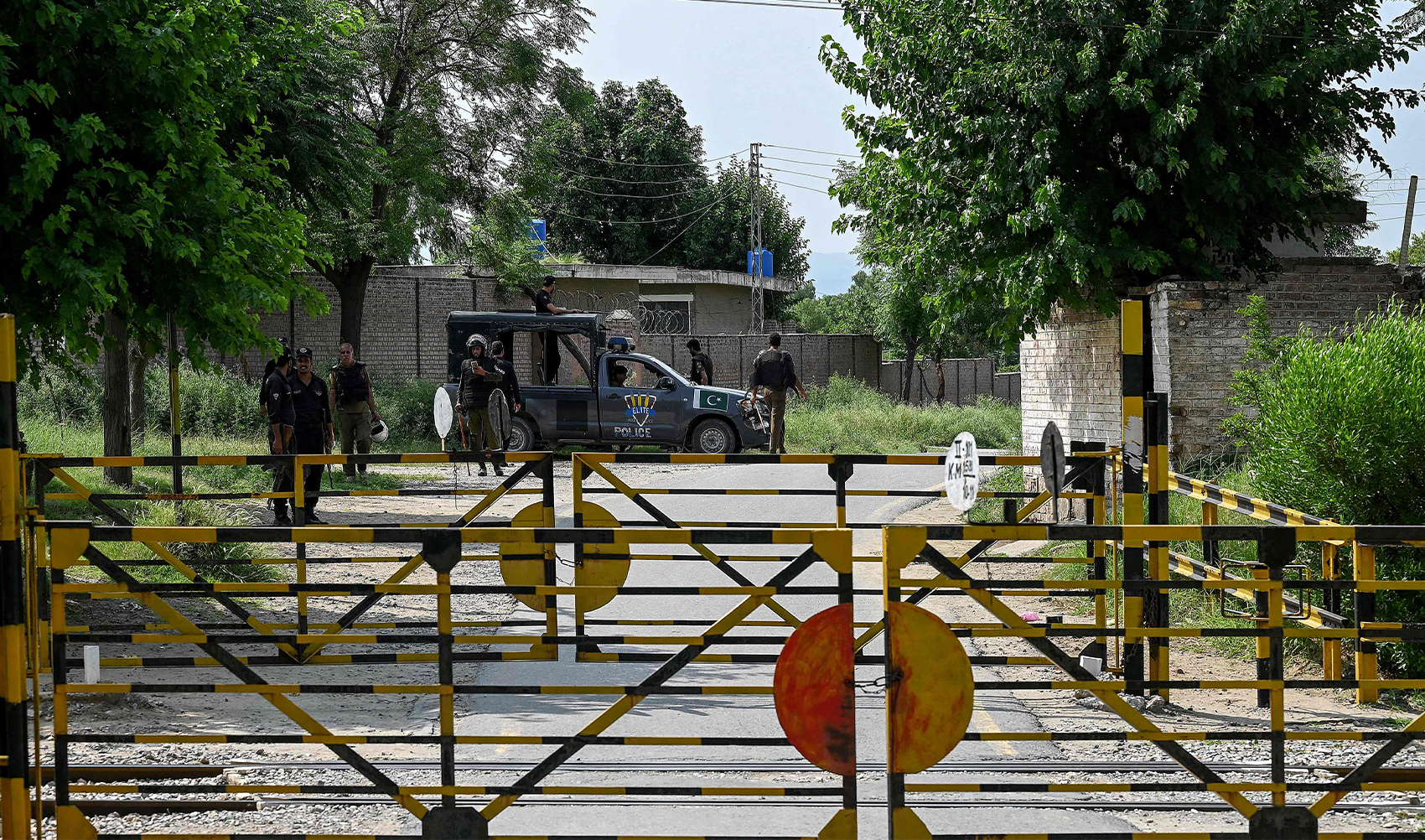 Policemen stand guard at the Attock prison post where Pakistan's former Prime Minister Imran Khan is being held for three years in Attock on August 6, 2023. (AFP)
