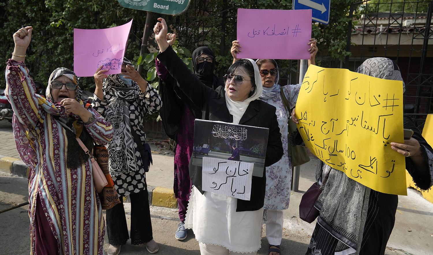 Supporters of Pakistan's former Prime Minister Imran Khan chant slogans during demonstration to condemn the arrest of their leader, in Lahore, Pakistan, on August 6, 2023. (AP