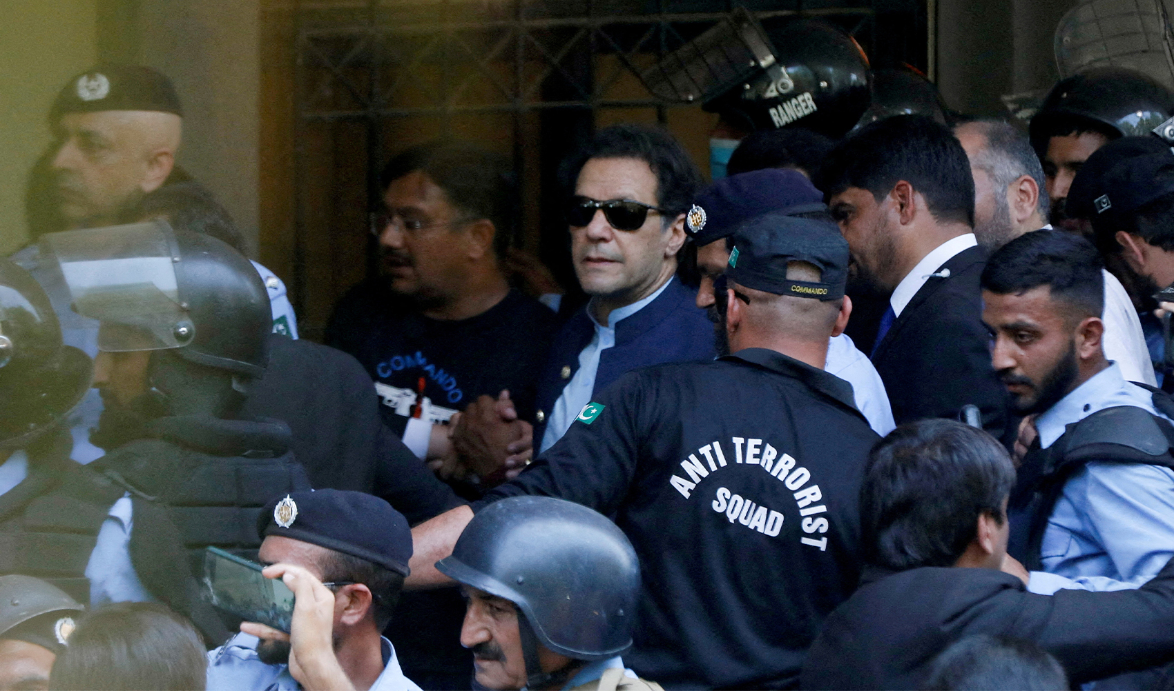 Security officers escort Pakistani former Prime Minister Imran Khan as he appeared in Islamabad High Court, Islamabad, Pakistan, on May 12, 2023. (REUTERS/File)