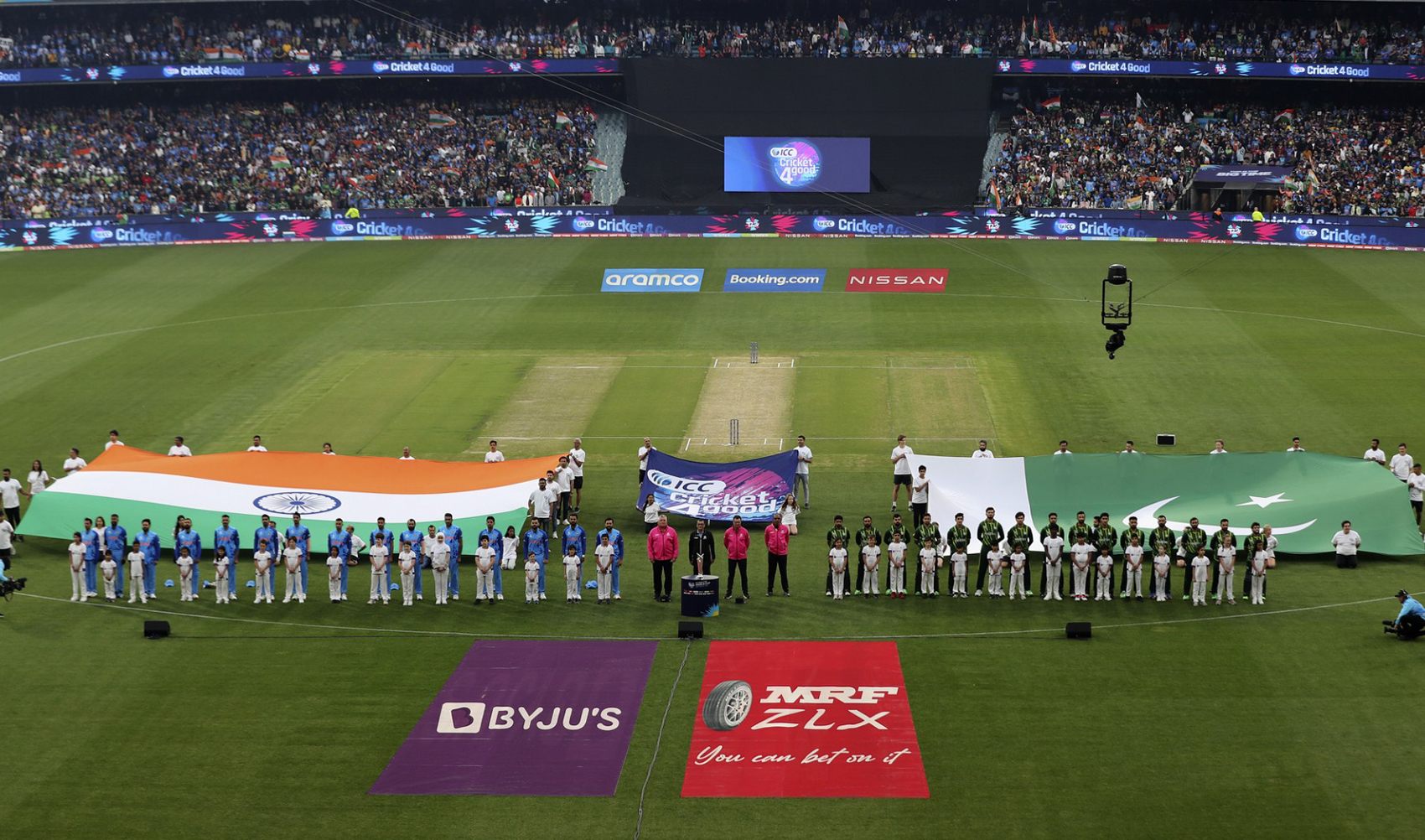 Teams India (L) and Pakistan line up for the national anthems during the ICC men's Twenty20 World Cup 2022 cricket match between India and Pakistan at Melbourne Cricket Ground (MCG) in Melbourne on October 23, 2022. (AFP/File)