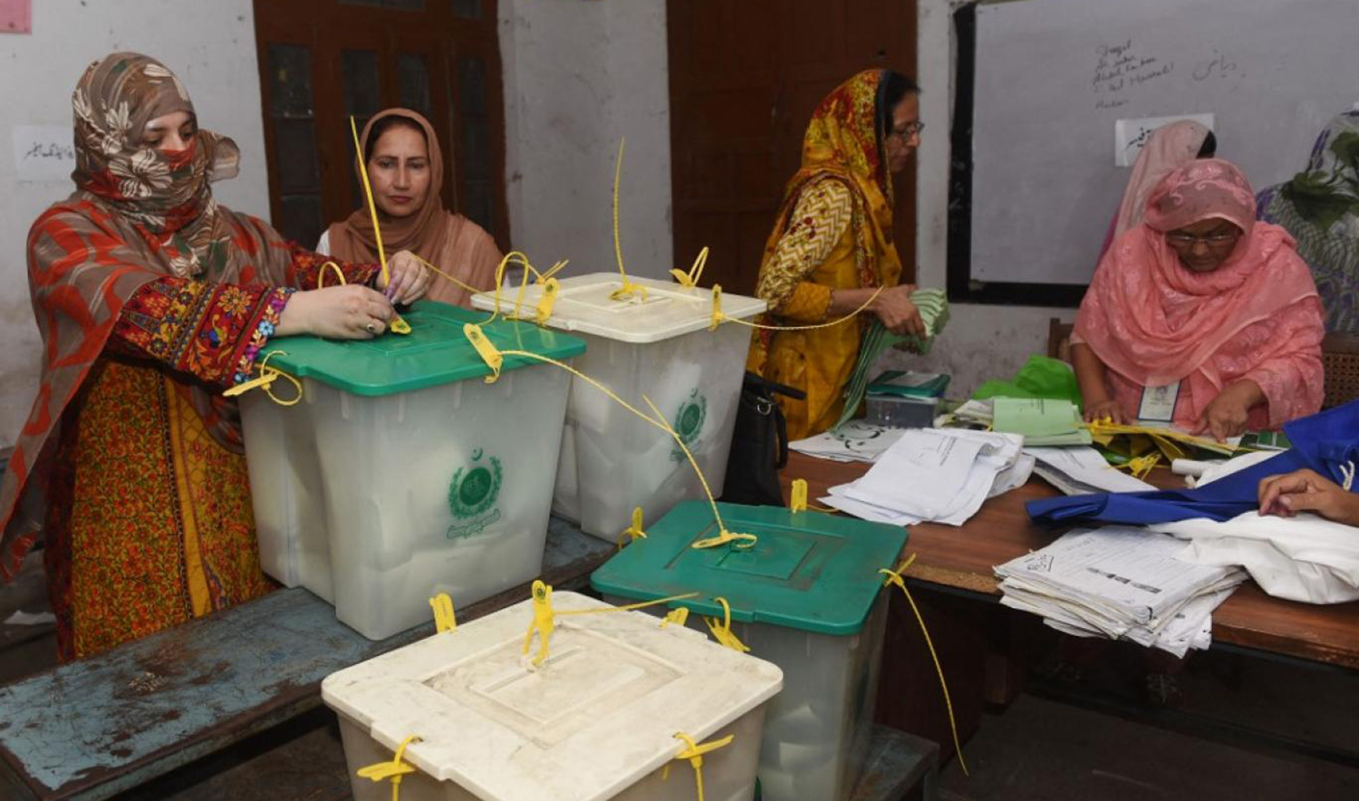 A Pakistani election official seal ballot boxes after after polls closed at a polling station in Lahore on July 25, 2018. (AFP/File)