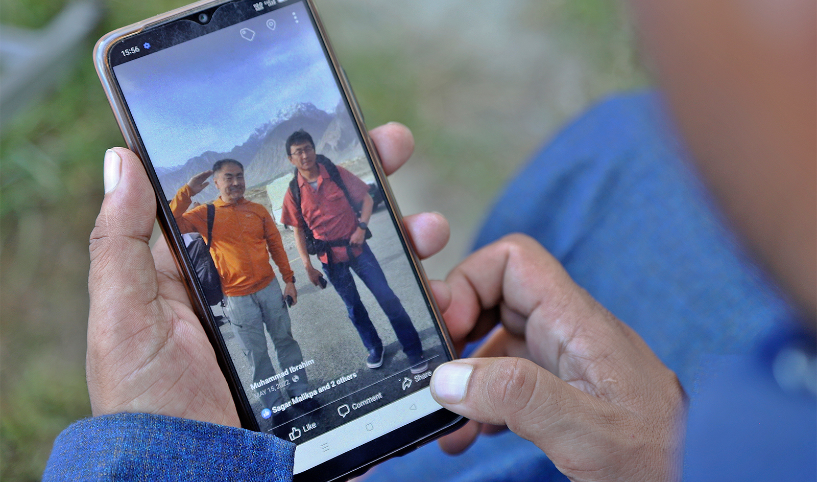 Pakistani guide Muhammad Ibrahim shows a picture of Japanese climbers, Semba Takayasu with Shinji Tamura (right), who was died during summiting highest and unscaled peaks, in his mobile, in Skardu, Pakistan, on August 15, 2023. (Photo courtesy: AP)