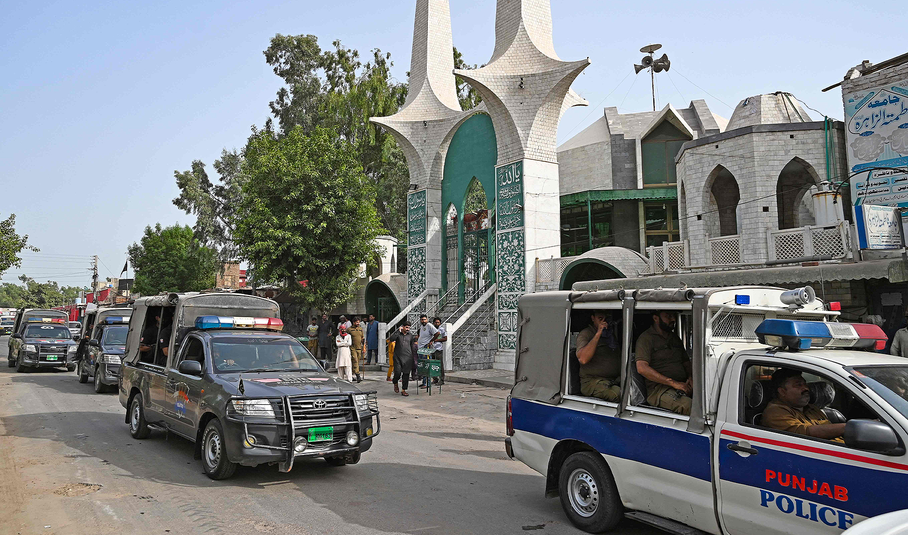 Police vehicles patrol near a Christian neighbourhood in Jaranwala on the outskirts of Faisalabad, Pakistan, on August 17, 2023, a day after an attack by Muslim men following allegations spread that Christians had desecrated the Qur'an. (Photo courtesy: AFP)