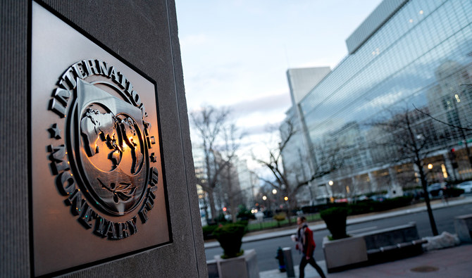 vhe seal for the International Monetary Fund is seen near the World Bank headquarters (R) in Washington, DC on January 10, 2022. (AFP/File)