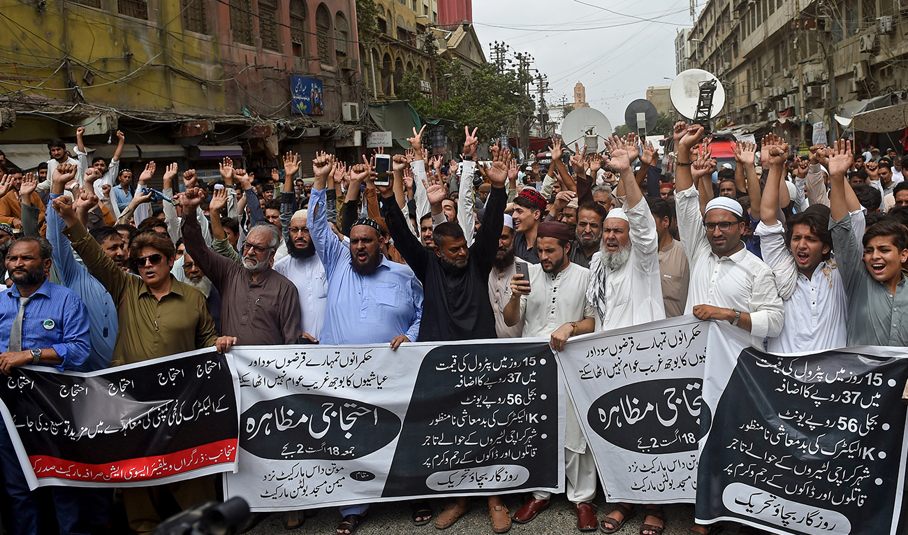 Protestors shout slogans against the surge in petrol and electricity prices during a rally along a street in Karachi on August 18, 2023, as Pakistan endures soaring inflation. (AFP/File)