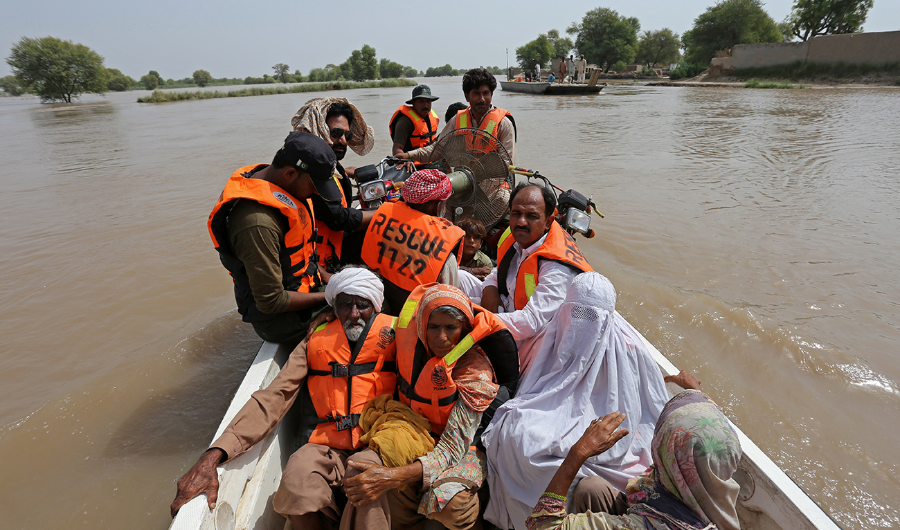 Flood affected people are being evacuated from a flooded area in Bahawalnagar of Punjab province on August 26, 2023. (Photo courtesy: AFP)
