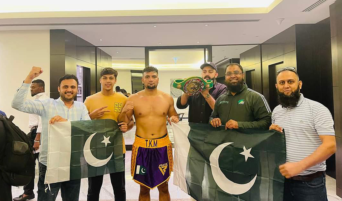 Pakistan's Taimoor Khan poses for a group photo with his team after winning the Asian Boxing Federation heavyweight title in Dubai on August 27, 2023. (Photo courtesy:Twitter/Imran Yousafzai)