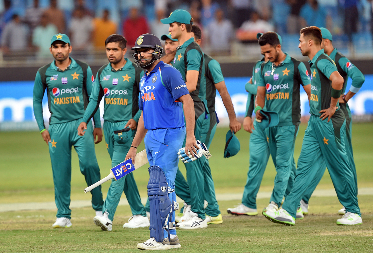 Indian cricketer, Rohit Sharma (C) and Pakistan team leave the field after India won by 9 wickets during the one day international match between Pakistan and India at the Dubai International Cricket Stadium in Dubai on September 23, 2018. (AFP/File)