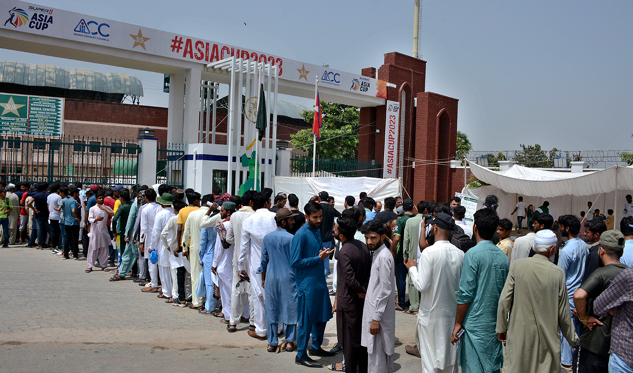 Cricket fans stand in a queue for security checkpoint as they arrive for opening one-day international cricket match of Asia Cup between Pakistan and Nepal, in Multan on August 30, 2023. (AP)