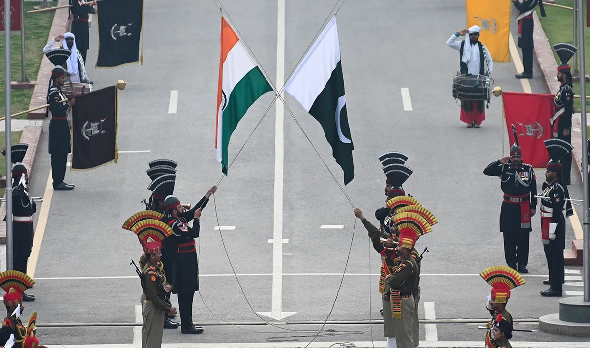 Indian Border Security Force (BSF) soldiers and Pakistani Rangers (in black) take part in the daily beating Retreat ceremony at the India Pakistan Wagah border post, some 35 Km from Amritsar on February 17, 2023. (AFP/File)