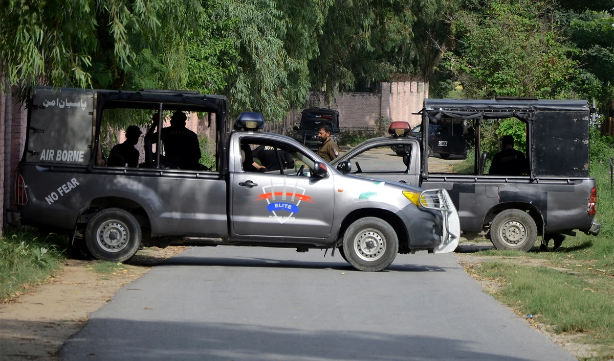 Police officers block a road leading to the the district prison in Attock, Pakistan, August 10, 2023, where Pakistan's former Prime Minister Imran Khan, imprisoned. (AP)
