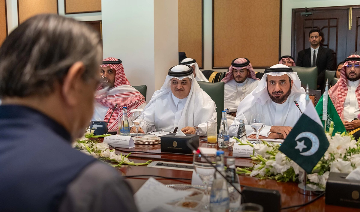 In this handout photo, taken and released by Saudi Hajj Ministry, Saudi Minister for Hajj and Umrah, Dr. Tawfiq Al-Rabiah (right), gestures during a meeting with Pakistani caretaker Minister of Religious Affairs and Interfaith Harmony Aniq Ahmed in Islamabad on August 21, 2023. (Photo courtesy: Saudi Hajj Ministry)