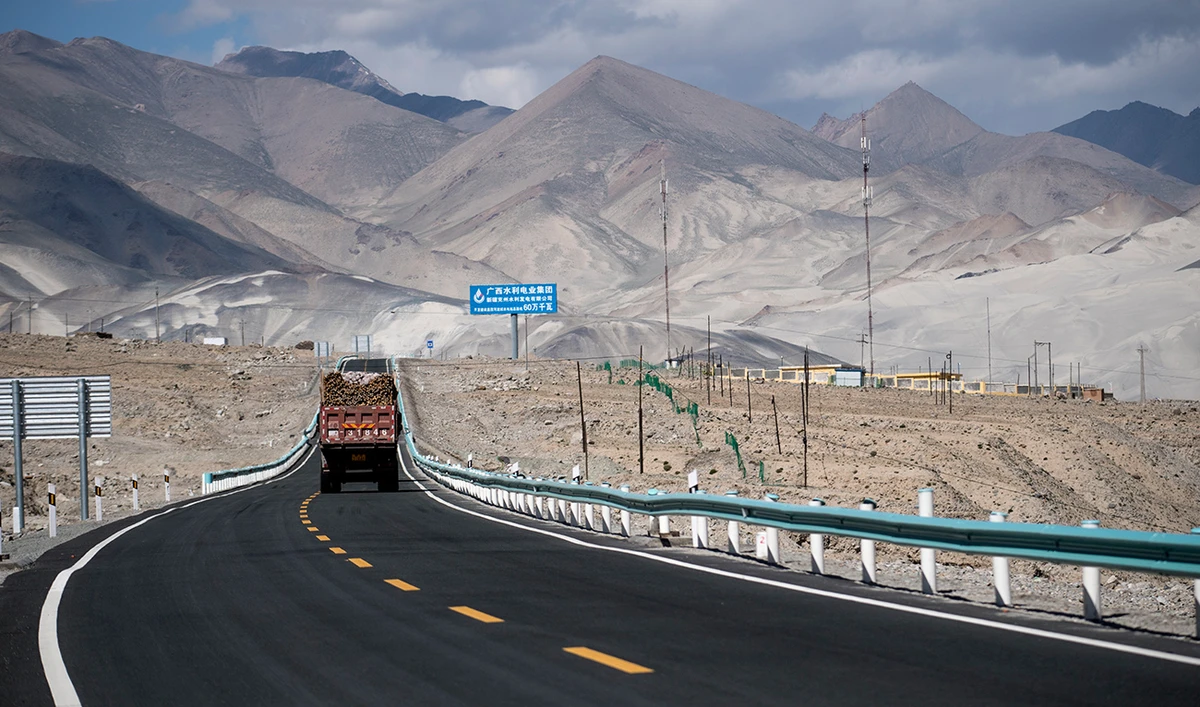 This picture taken on June 27, 2017 shows a truck driving along the China-Pakistan Friendship Highway before the Karakorum mountain range near Tashkurgan in China's western Xinjiang province. (AFP/File)