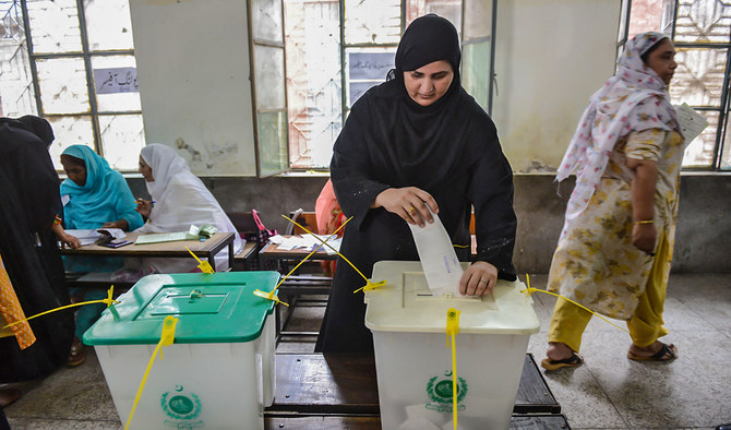 A woman casts her vote during Pakistan's general election at a polling station during the general election in Lahore, Pakistan, on July 25, 2018. (AFP/File)