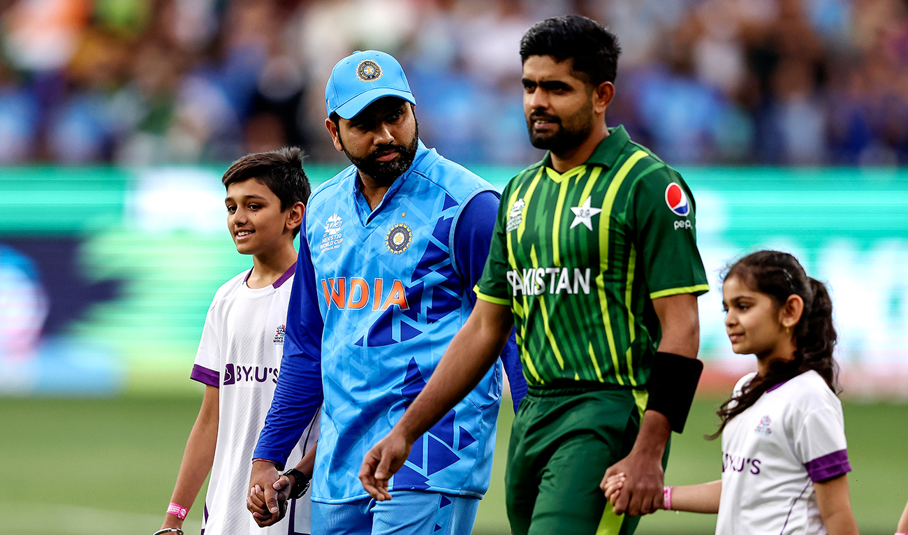 India's Rohit Sharma (L) and Pakistan's Babar Azam lead their teams onto the ground during the ICC men's Twenty20 World Cup 2022 cricket match between India and Pakistan at Melbourne Cricket Ground (MCG) in Melbourne on October 23, 2022. (AFP/File)