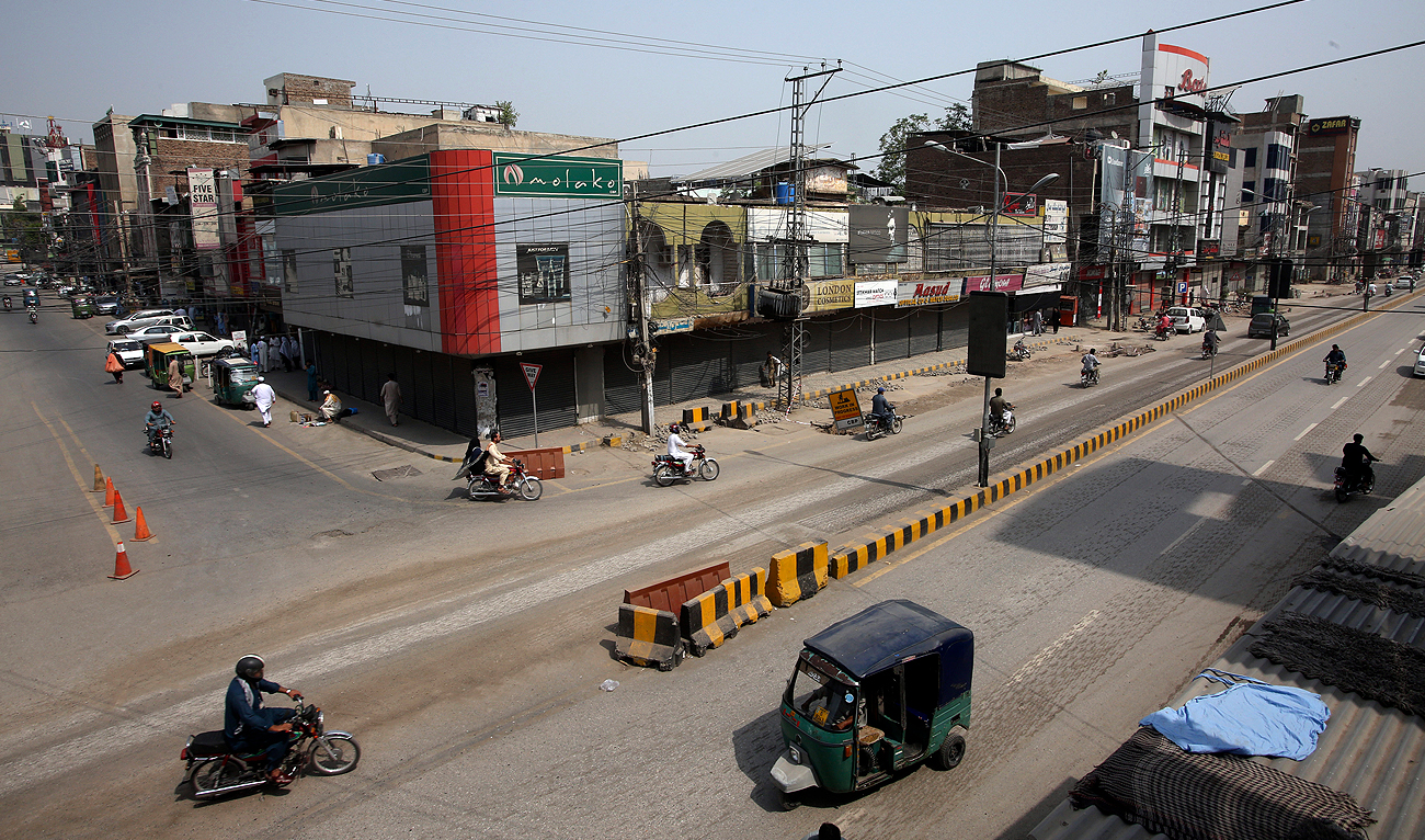 Pakistani shopkeepers close their businesses during strike against inflation in Karachi on September 2, 2023. (AP)
