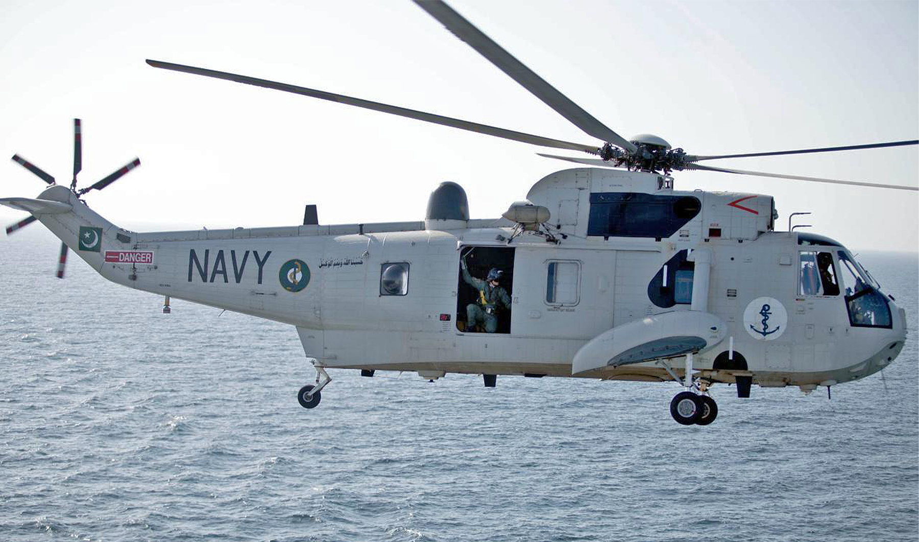 The picture shared by Pakistan Navy on September 4, 2023, shows a Pakistani Navy helicopter flying above a sea. (Photo courtesy: Pakistan Navy)