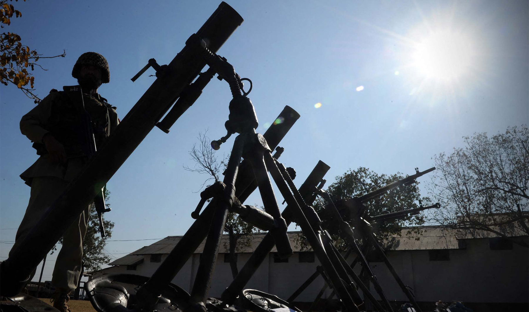A Pakistani frontier corp displays the seized weapons and ammunitions for the media in Bara, a town of the Khyber area on January 1, 2012. (Photo courtesy: AFP/File)