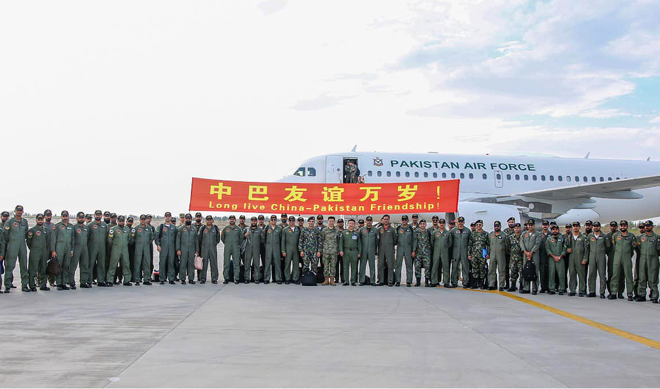 In this handout photo officials from Pakistani and Chinese air forces gesture for a group photo ahead of China-Pakistan joint air exercise 'Shaheen-X' in the northwestern city of Jiuquan, China on September 5, 2023. (Photo courtesy: PAF)