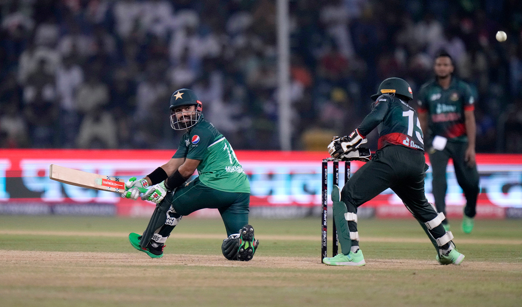 Pakistan's Mohammad Rizwan, left, follows the ball after playing a shot for boundary during the Asia Cup cricket match between Pakistan and Bangladesh in Lahore, Pakistan, on September 6, 2023. (Photo courtesy: AP)