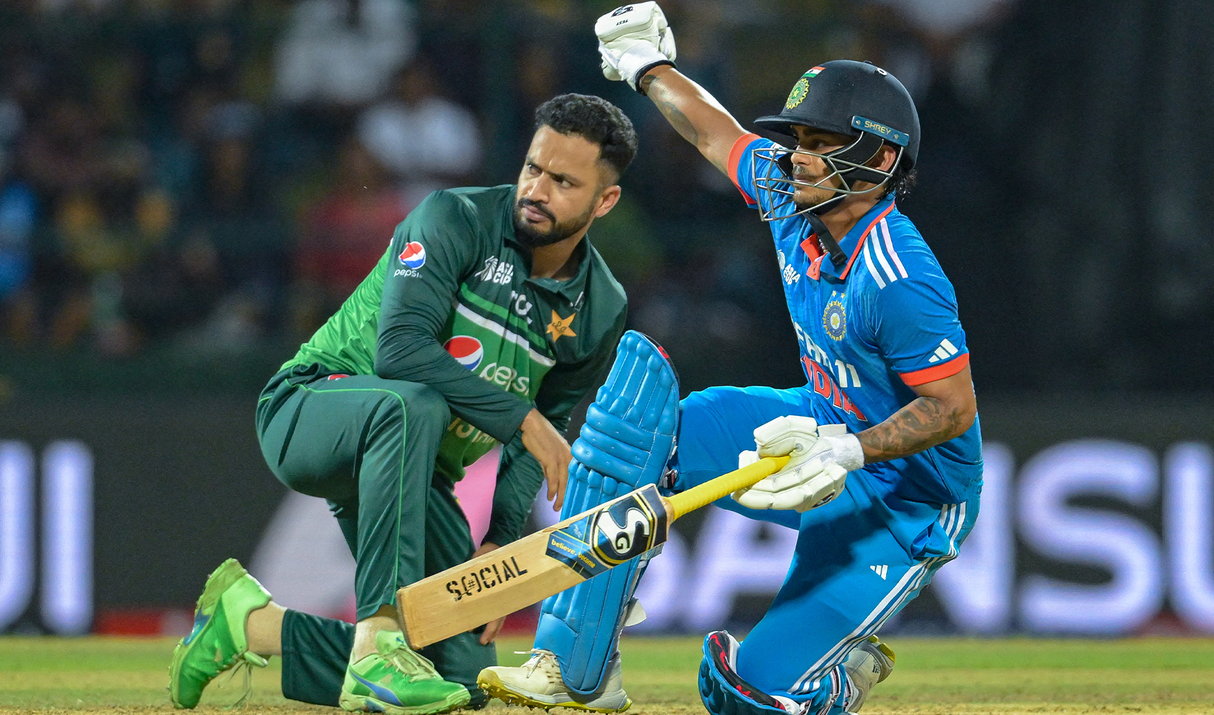India's Ishan Kishan (R) falls on the ground during the Asia Cup 2023 one-day international (ODI) cricket match between India and Pakistan at the Pallekele International Cricket Stadium in Kandy, Sri Lanka on September 2, 2023. (Photo courtesy: AFP/File)